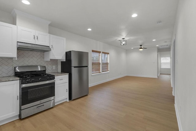 2831 Jones St, Houston, TX 77026 - kitchen featuring stainless steel appliances, under cabinet range hood, ceiling fan, white cabinetry, and recessed lighting