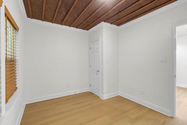 2831 Jones St, Houston, TX 77026 - spare room featuring light wood-type flooring, ornamental molding, and wood ceiling