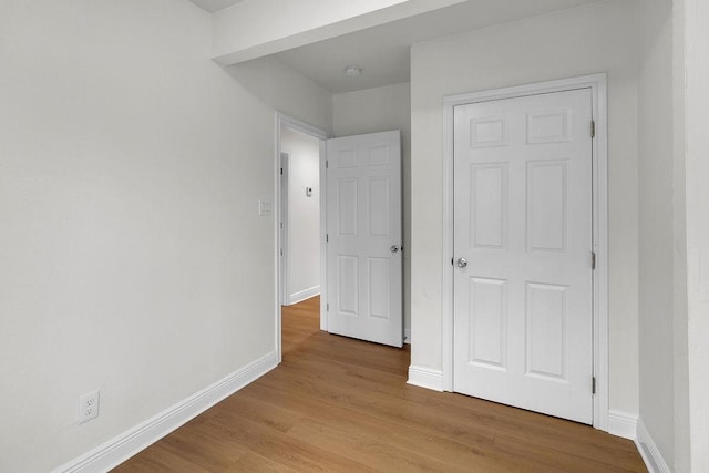 2831 Jones St, Houston, TX 77026 - unfurnished bedroom with baseboards and wood finished floors
