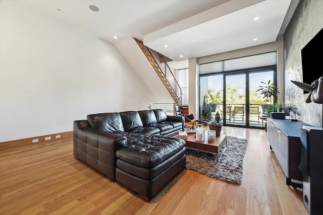 5417 Hidalgo St Unit B, Houston, TX 77056 - living room featuring wood finished floors, stairs, and recessed lighting