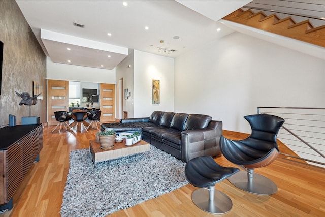5417 Hidalgo St Unit B, Houston, TX 77056 - living room with recessed lighting, wood finished floors, lofted ceiling, and baseboards