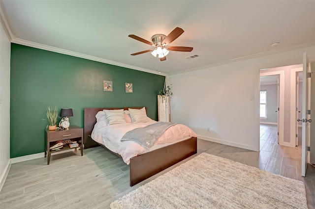 5806 Cartagena St, Houston, TX 77035 - bedroom featuring baseboards, visible vents, crown molding, and wood finished floors