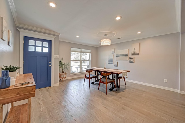 5806 Cartagena St, Houston, TX 77035 - dining space with light wood finished floors, baseboards, recessed lighting, and ornamental molding