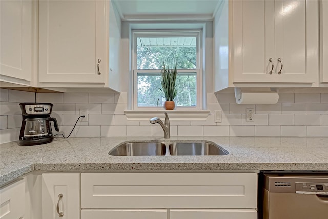 5806 Cartagena St, Houston, TX 77035 - kitchen featuring white cabinets, a sink, tasteful backsplash, and stainless steel dishwasher