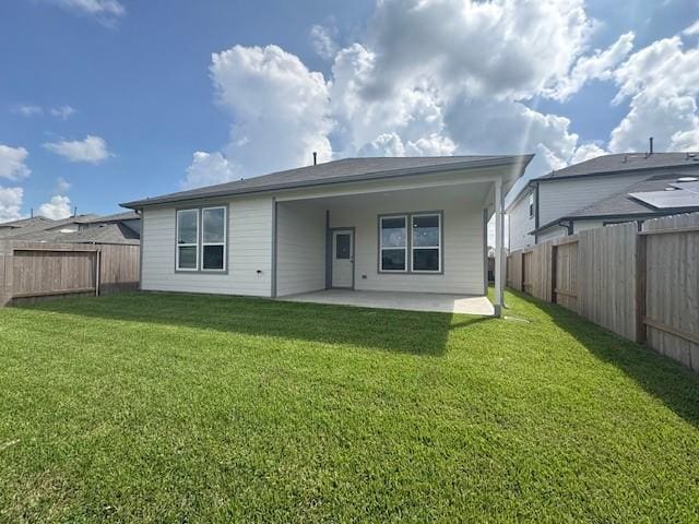 25519 Balsamroot Dr, Magnolia, TX 77355 - rear view of house with a patio area and a fenced backyard