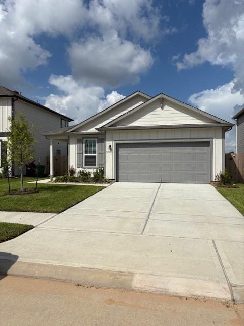 25519 Balsamroot Dr, Magnolia, TX 77355 - ranch-style house with driveway and a garage