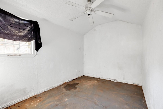 2320 Westward Ave, La Marque, TX 77568 - spare room with concrete floors, a ceiling fan, and lofted ceiling