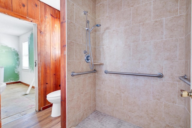 2320 Westward Ave, La Marque, TX 77568 - bathroom with toilet, a stall shower, and wood finished floors