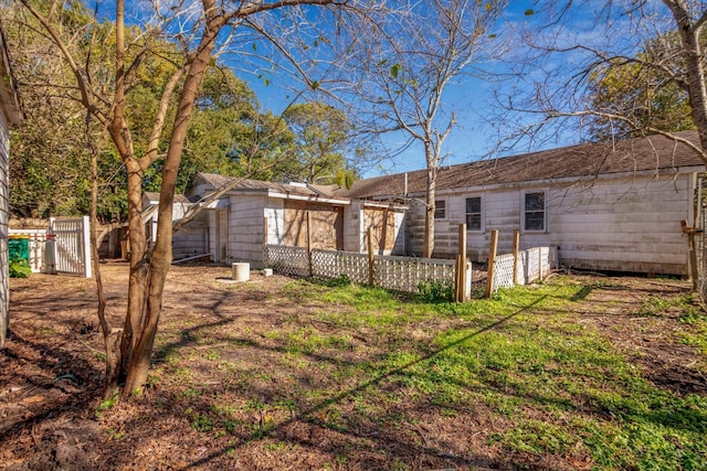 2320 Westward Ave, La Marque, TX 77568 - back of house featuring fence and a gate