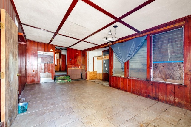 2320 Westward Ave, La Marque, TX 77568 - unfurnished living room with coffered ceiling and wooden walls