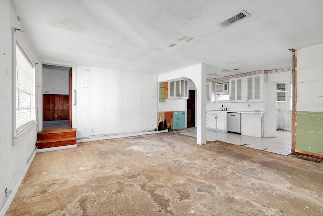 2320 Westward Ave, La Marque, TX 77568 - unfurnished living room with visible vents and arched walkways