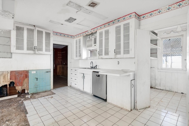 2320 Westward Ave, La Marque, TX 77568 - kitchen with white cabinets, glass insert cabinets, dishwasher, and a sink