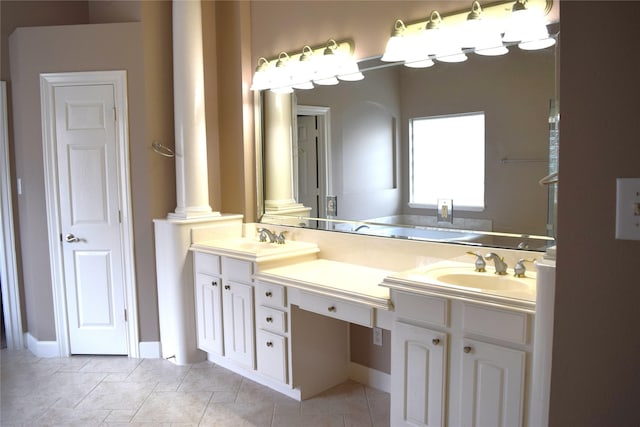 full bath with double vanity, tile patterned floors, and a sink