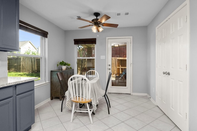 8922 Eaglecove Dr, Houston, TX 77064 - dining space with light tile patterned floors, visible vents, baseboards, and a ceiling fan