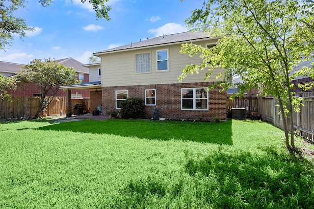 8922 Eaglecove Dr, Houston, TX 77064 - back of house with brick siding, a fenced backyard, cooling unit, and a lawn