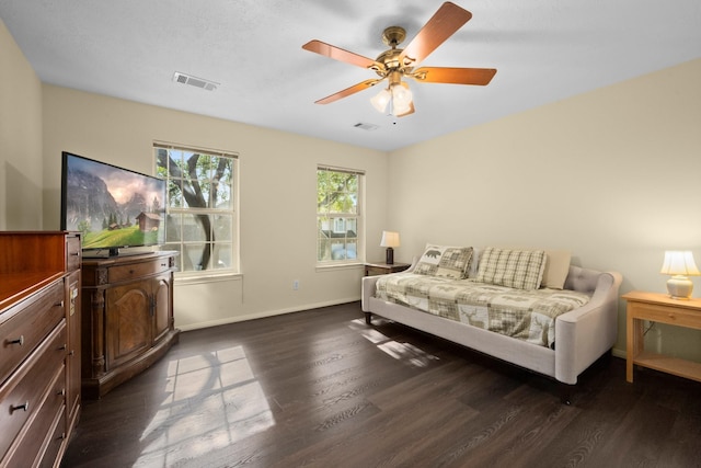 8922 Eaglecove Dr, Houston, TX 77064 - bedroom featuring visible vents, baseboards, a ceiling fan, and wood finished floors