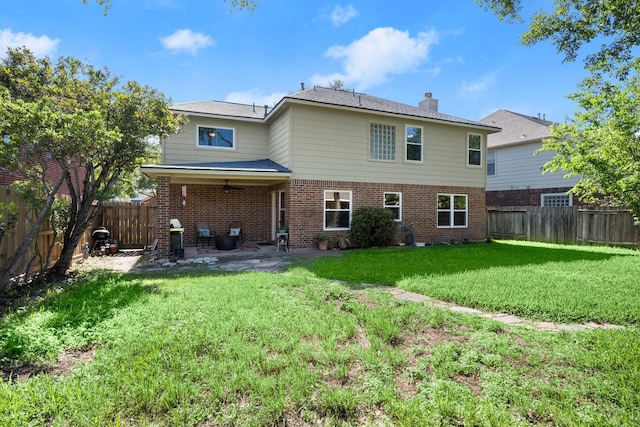 8922 Eaglecove Dr, Houston, TX 77064 - back of property featuring a patio, a yard, a fenced backyard, and brick siding