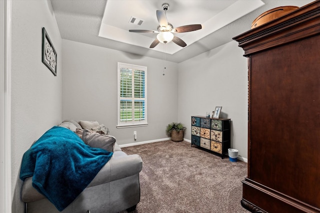 9791 Waller St, Conroe, TX 77303 - sitting room with baseboards, carpet flooring, a ceiling fan, visible vents, and a tray ceiling