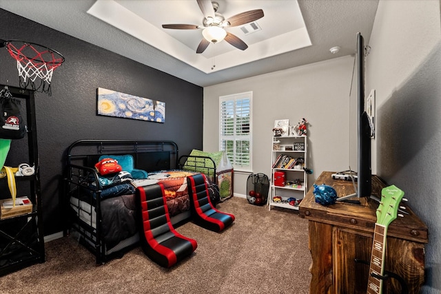 9791 Waller St, Conroe, TX 77303 - bedroom featuring visible vents, baseboards, a raised ceiling, ceiling fan, and carpet flooring