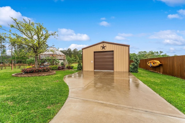 9791 Waller St, Conroe, TX 77303 - garage with concrete driveway and fence