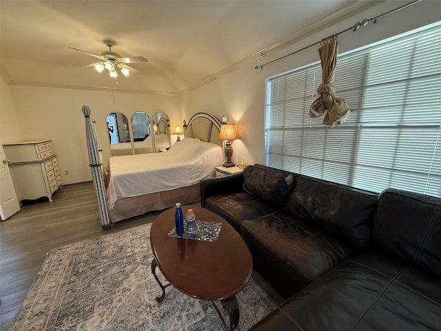 bedroom with ceiling fan and wood finished floors