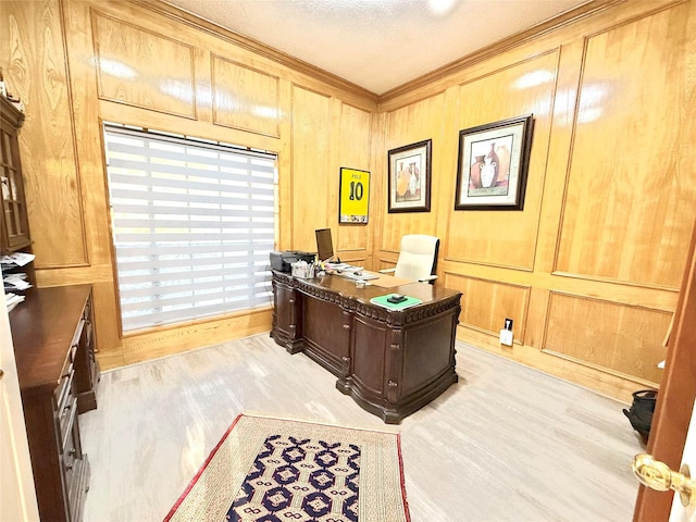 7615 Clover Canyon Cir, Houston, TX 77095 - office area featuring crown molding, light wood finished floors, a textured ceiling, and wood walls
