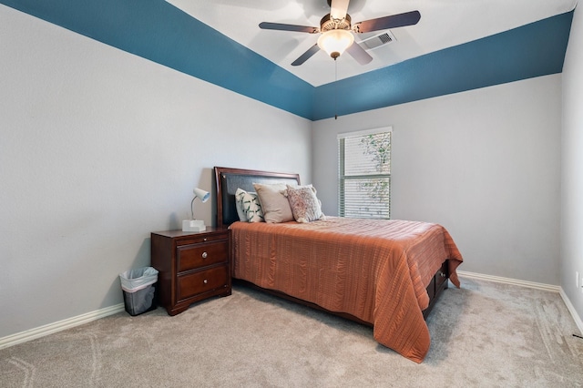 bedroom with baseboards, visible vents, a ceiling fan, and light colored carpet