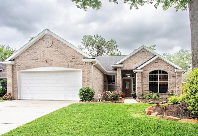 ranch-style home with brick siding, a front yard, driveway, and a garage