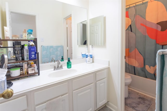 bathroom featuring vanity, toilet, and shower / bathtub combination with curtain