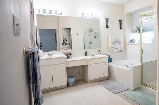 full bathroom featuring a shower stall, a garden tub, and double vanity