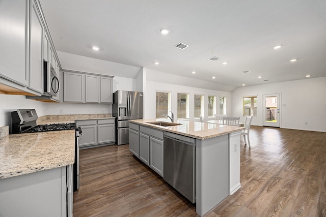 kitchen featuring gray cabinetry, a sink, dark wood-type flooring, and appliances with stainless steel finishes