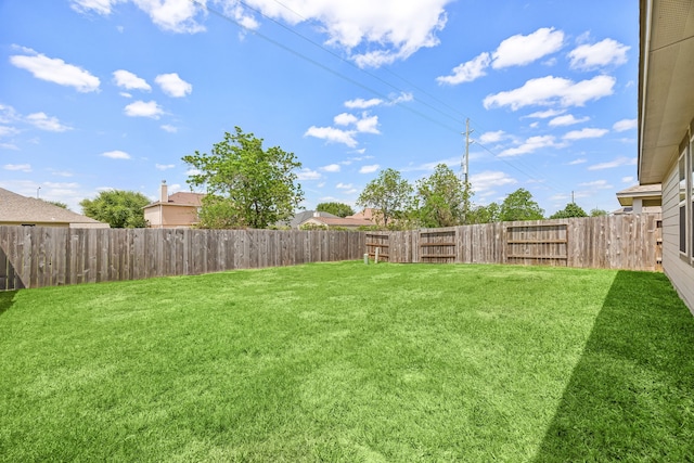 view of yard featuring a fenced backyard