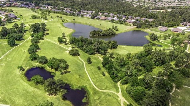 aerial view featuring a residential view, golf course view, and a water view