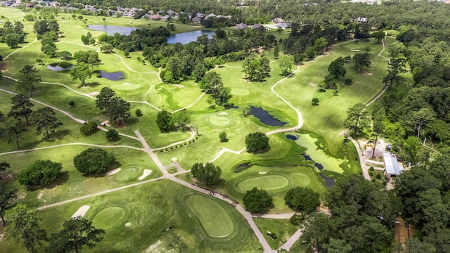 aerial view with view of golf course and a water view