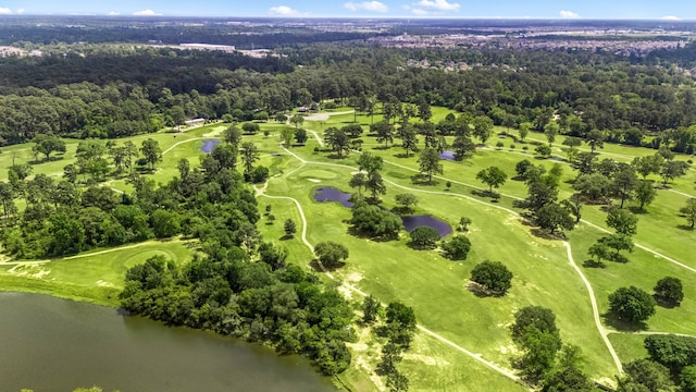 bird's eye view featuring golf course view, a forest view, and a water view