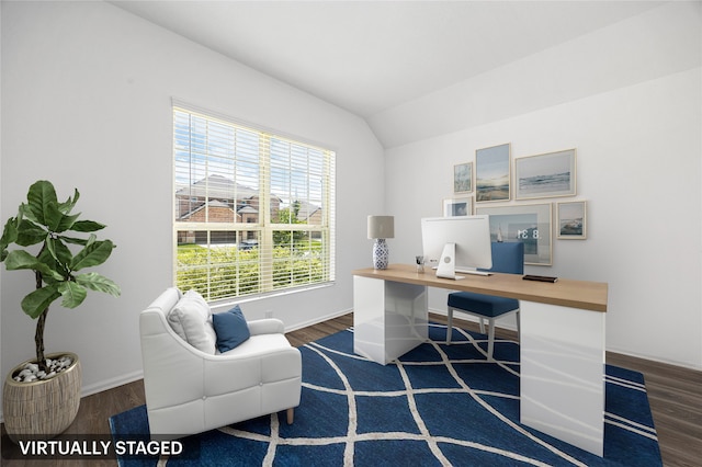 office space featuring lofted ceiling, baseboards, and wood finished floors