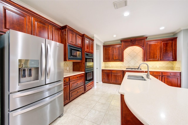 13214 Dusty Grove Ln, Sugar Land, TX 77498 - kitchen featuring black appliances, dark brown cabinets, ornamental molding, a sink, and light countertops
