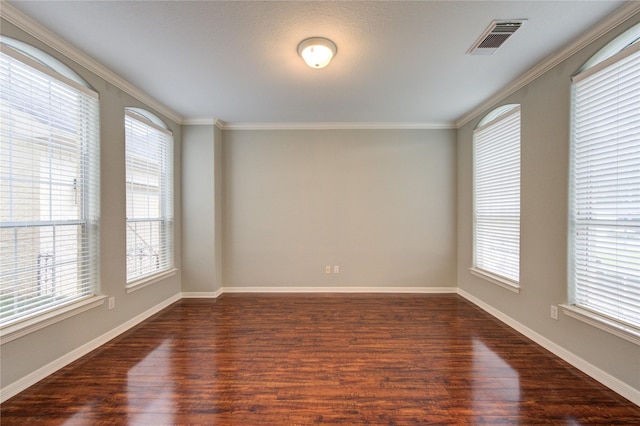 13214 Dusty Grove Ln, Sugar Land, TX 77498 - empty room featuring dark wood-style floors, plenty of natural light, crown molding, and baseboards