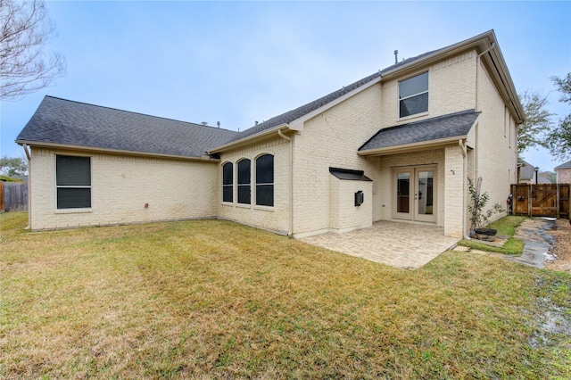 13214 Dusty Grove Ln, Sugar Land, TX 77498 - back of house featuring french doors, a fenced backyard, a patio, brick siding, and roof with shingles