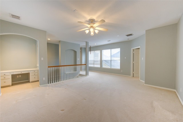 13214 Dusty Grove Ln, Sugar Land, TX 77498 - spare room featuring light carpet, a ceiling fan, baseboards, and an office area