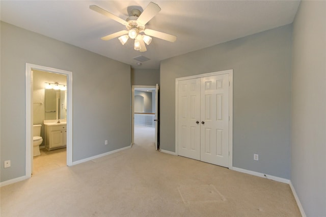 13214 Dusty Grove Ln, Sugar Land, TX 77498 - unfurnished bedroom featuring light carpet, a closet, baseboards, connected bathroom, and a ceiling fan