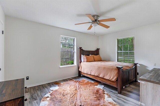 507 E Linney St, Dayton, TX 77535 - bedroom featuring baseboards, ceiling fan, and wood finished floors