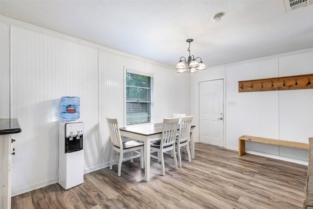 507 E Linney St, Dayton, TX 77535 - dining room with a notable chandelier, visible vents, and wood finished floors