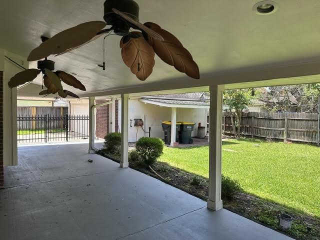 view of patio / terrace featuring fence and ceiling fan