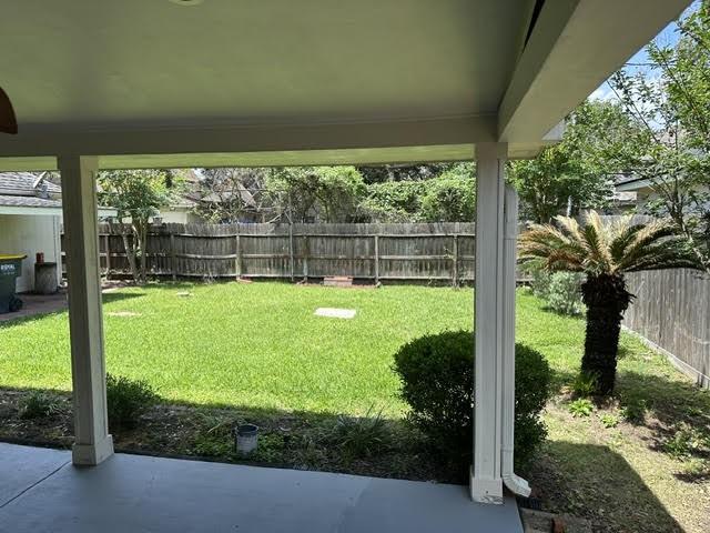 view of yard with a patio and a fenced backyard