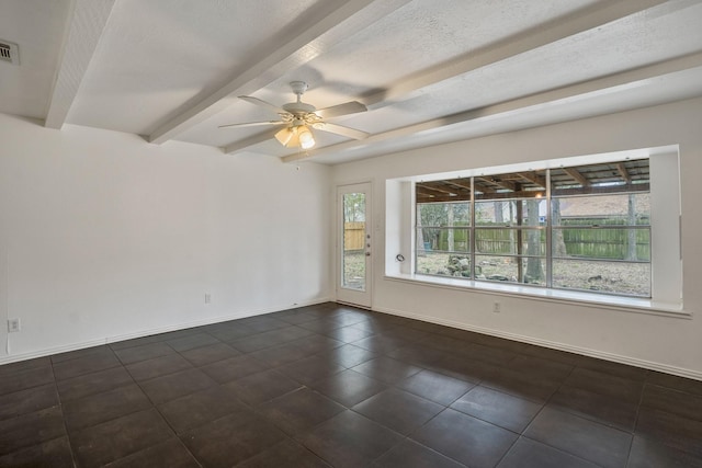 23123 Lestergate Dr, Spring, TX 77373 - unfurnished room featuring dark tile patterned flooring, beamed ceiling, ceiling fan, and baseboards
