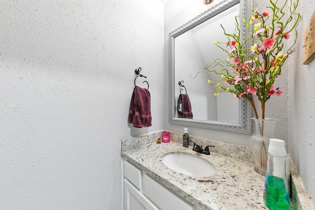 6506 Kentwick Dr, Houston, TX 77084 - bathroom featuring a textured wall and vanity