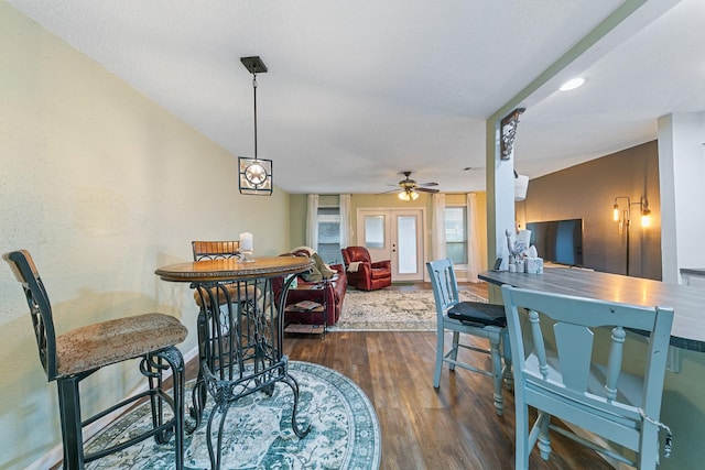 6506 Kentwick Dr, Houston, TX 77084 - dining space with a ceiling fan, dark wood-style flooring, and baseboards