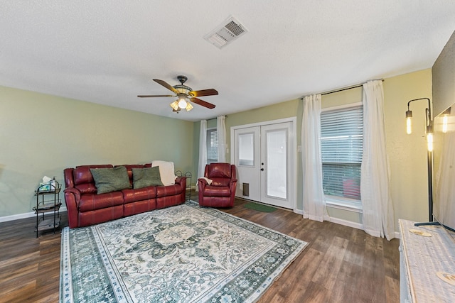 6506 Kentwick Dr, Houston, TX 77084 - living area with baseboards, visible vents, a ceiling fan, and dark wood-style flooring