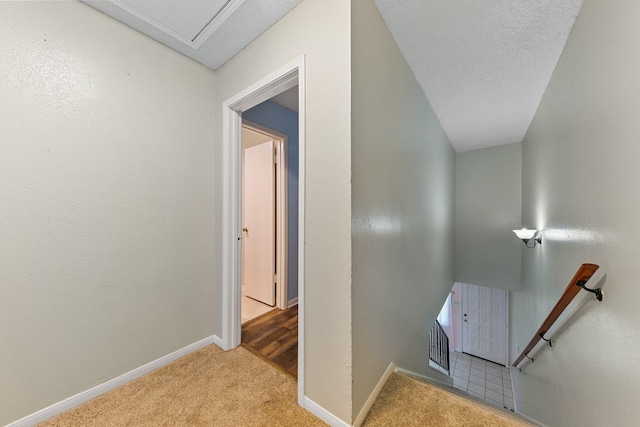 6506 Kentwick Dr, Houston, TX 77084 - stairs featuring baseboards, carpet, and a textured ceiling